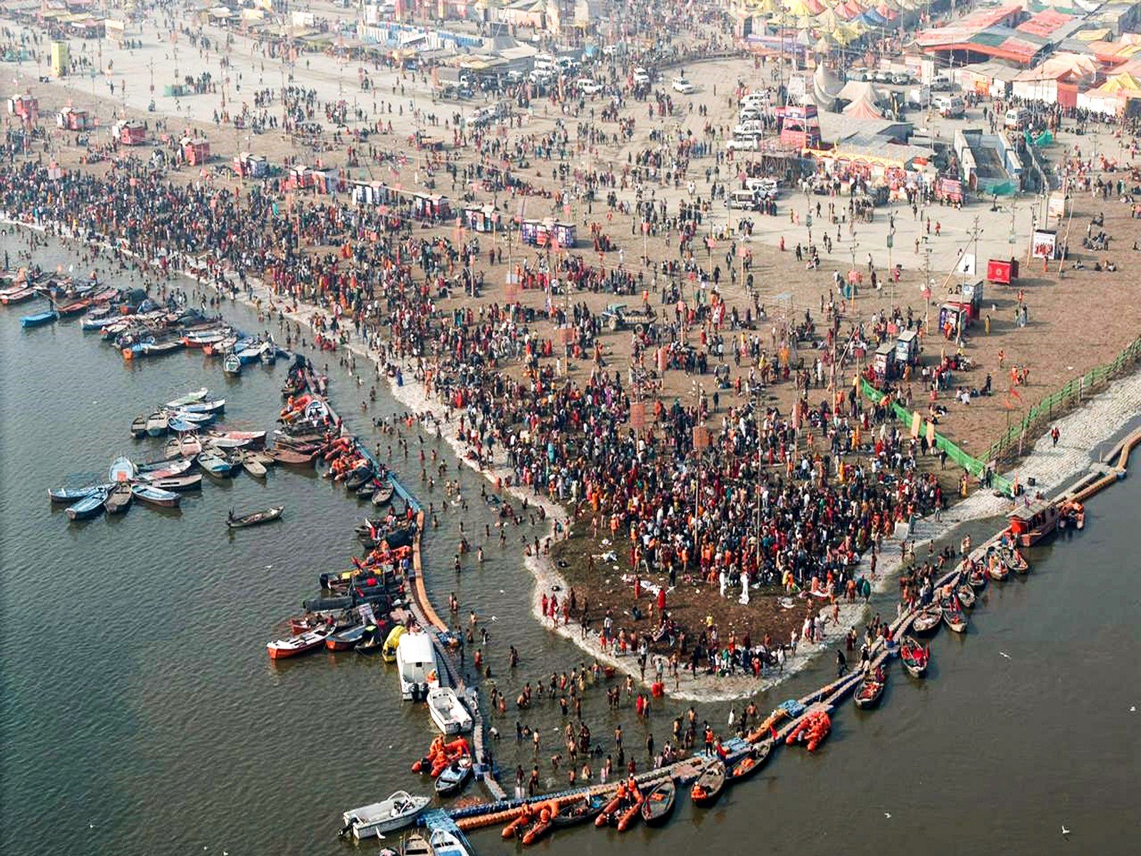 Devotees gather at the ongoing Magh Mela at the Triveni Sangam